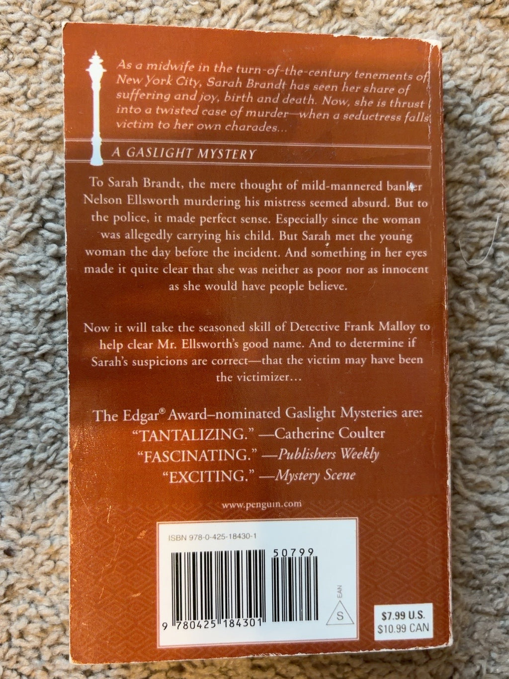 Murder on Washington Square by Victoria Thompson — actual used copy, back cover