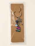 Vintage Key Book Stack Keychain on a kraft card in a clear sleeve